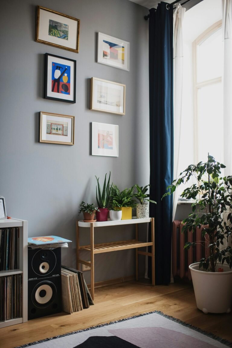 Stylish living room featuring indoor plants, wall art, and a cozy atmosphere.